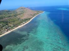 Mer Island - Aerial view of island and reef flat