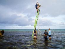 Installation of a real-time weather and ocean observing station at Masig in July 2013