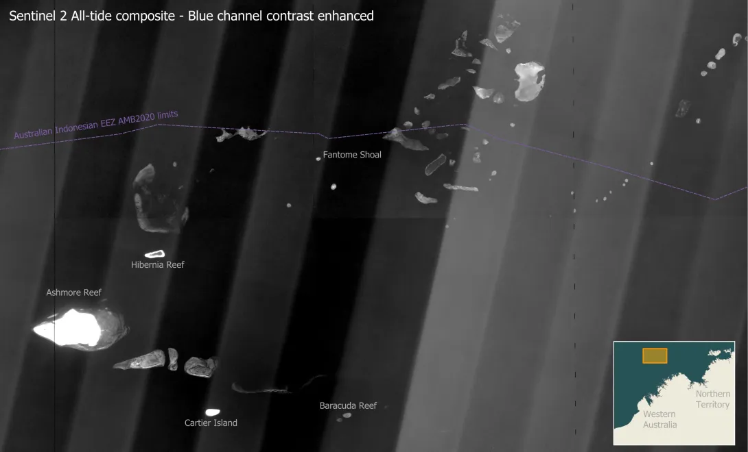 Grey scale satellite imagery of the north west shelf of Australia showing a large number of coral reef banks along the edge of the continental shelf. These reefs straddle the Australian Indonesian Exclusive Economic Zone.